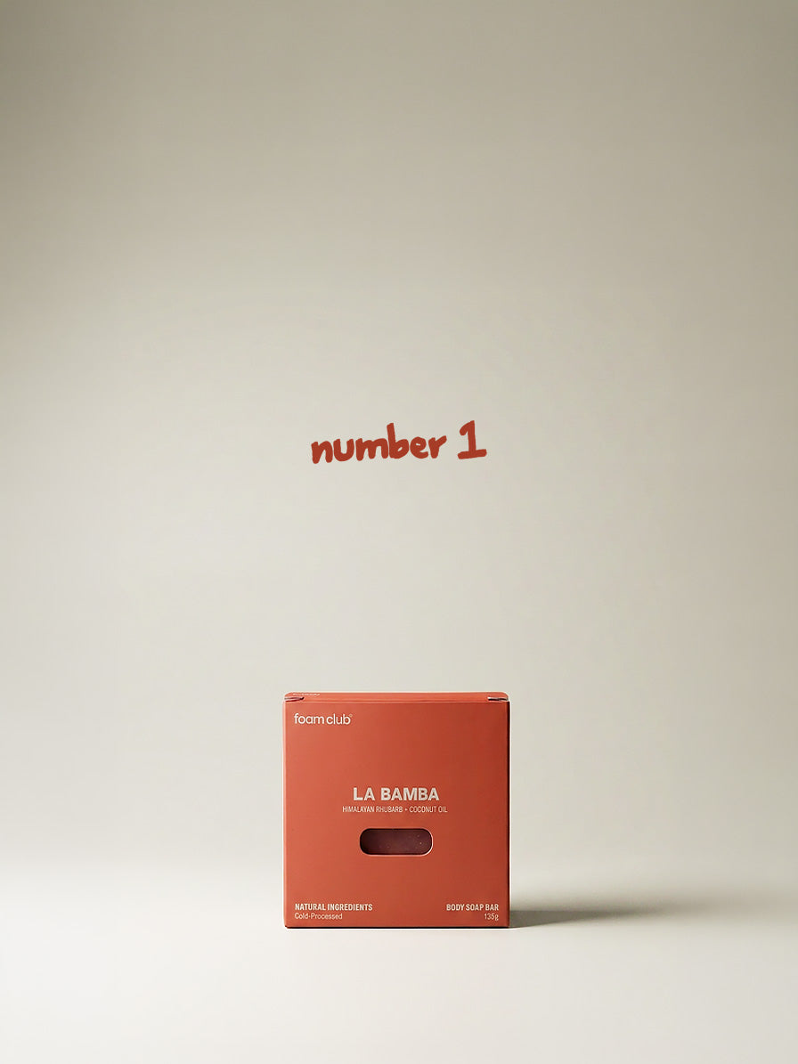 natural soap bar standing up with white background with the text number one written above it
